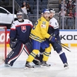 COLOGNE, GERMANY - MAY 16: Sweden's Elias Lindholm #28 battles with Slovakia's Michal Sersen #8 while Julius Hudacek #33 looks on during preliminary round action at the 2017 IIHF Ice Hockey World Championship. (Photo by Andre Ringuette/HHOF-IIHF Images)

